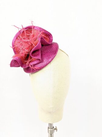 Bright pink and orange button hat