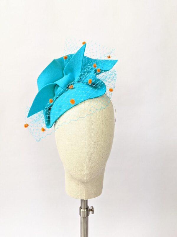 Blue fascinator with orange veiling