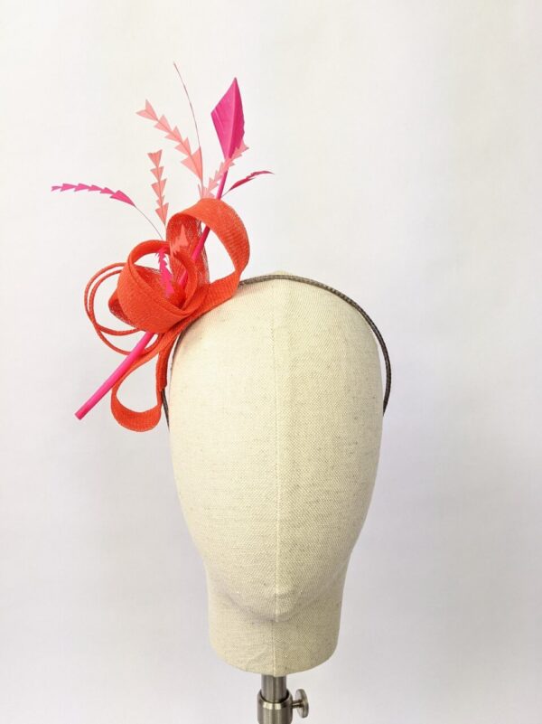 Bright orange fascinator